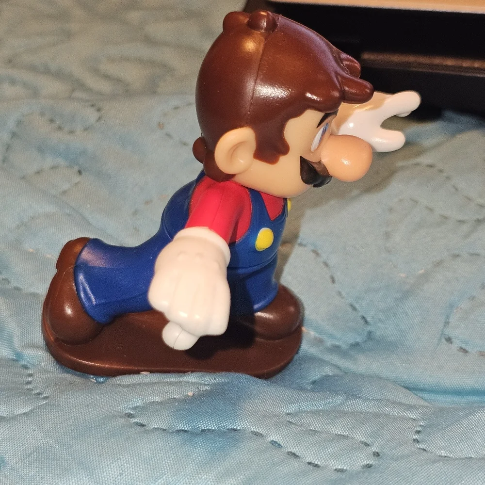 McDonald's Happy Meal toy featuring Mario from the Super Mario Bros. franchise.‎